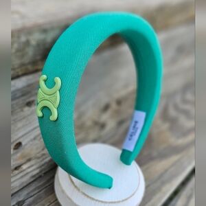 Elegant Teal Headband with Unique Emblem